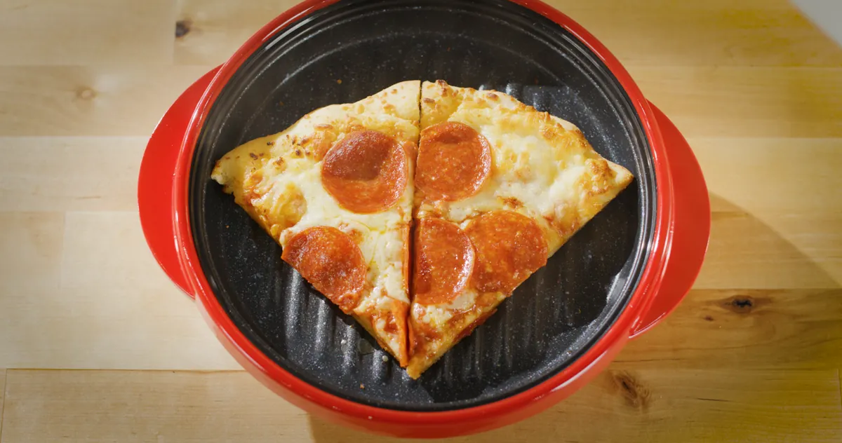 Two slices of pepperoni pizza on the Rocket Chef's ridged grill surface